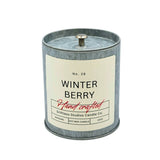 Candle with 'Winter Berry' label on a white background