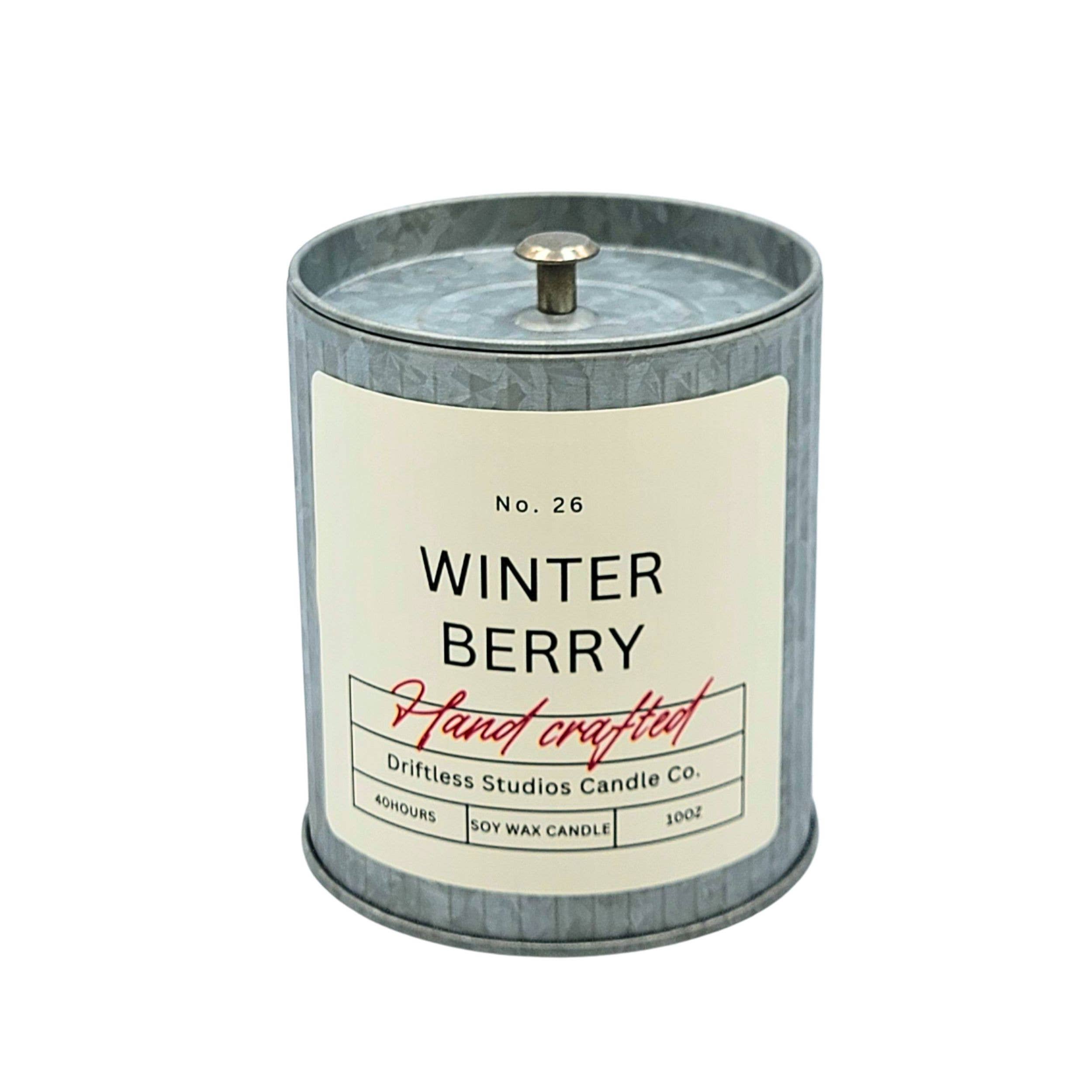 Candle with 'Winter Berry' label on a white background