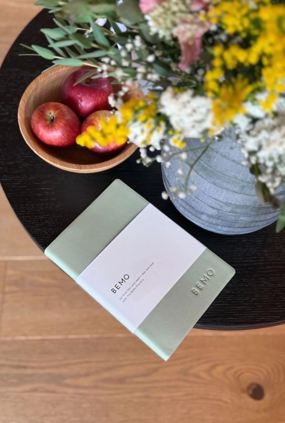 BeMo Journal in Soothing Sage Green on a table with apples and flowers